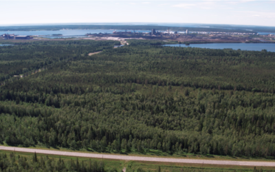 Flygbild med Hertsöfältet och Luleå hamn i horisonten